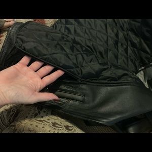 Women’s black leather motorcycle jacket